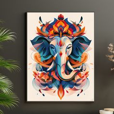 an elephant's head is painted on a white wall next to a potted plant