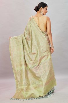 Look your ethnic best at weddings and special occasions in this beautiful Pistachio green Tanchoi Banarasi silk saree. It is enhanced with zari border and comes with a matching blouse piece. Disclaimer: The shown stitched blouse on the model is for display purpose only. The saree comes with a matching blouse piece and finished with fall and piko. Green Semi-stitched Pre-draped Saree With Meenakari, Green Pre-draped Saree With Meenakari For Festivals, Green Meenakari Banarasi Silk Pre-draped Saree, Bollywood Style Green Meenakari Pre-draped Saree, Bollywood Green Meenakari Pre-draped Saree, Festive Green Pre-draped Saree With Meenakari, Green Chikankari Embroidery Pre-draped Saree For Diwali, Green Chikankari Embroidered Pre-draped Saree For Diwali, Green Pre-draped Saree With Chikankari For Diwali