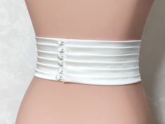 The Couture Pleated Bridal Belt is a stunning and elegant accessory that adds a touch of sophistication to any wedding dress. Handmade with meticulous attention to detail, this belt is crafted from luxurious matte satin, known for its smooth texture. The wide pleated design measures 3.5 inches (9cm) in width, creating a visually striking effect that cinches the waist and accentuates the curves. Width 3.5 inches (9cm) Fabric: Satin Duchess (shown in the photo) Color: light ivory (shown in the pho Belt Design For Dress, Belt For Wedding Dress, Bridal Nightgown, Satin Belt, Wedding Sash Belt, Duchess Satin, For Wedding Dress, Etsy Wedding Dress, Light Ivory