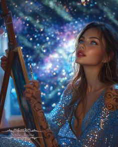 a beautiful woman holding an easel in front of a painting on a canvas with glitters all over it