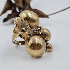 "An antique gold statement ring with a flower among the rough rocks hammered ring to all your outdoor adventures, or a night out in the city. It's so versatile! Very light and comfortable despite the impressive appearance THE DETAILS: ❆ This ring is ADJUSTABLE and fits ALL SIZES! ❆ Pendant Width: 1.8\" (5 CM) ❆ Pendant Width: 1.5\" (4 CM) ❆ Weight 14 gram https://www.etsy.com/listing/771525436 Welcome to my REOPEN Etsy shop I opened my Etsy shop 4 years ago but unfortunately, I couldn't handle i Handmade Elegant Brass Flower Ring, Vintage Adjustable Gold Flower Ring, Adjustable Gold Brass Flower Ring, Antique Hand-cast Brass Rings, Flower-shaped Bronze Brass Jewelry, Round Dangle Earrings, Hammered Ring, Flower Vintage, Hammered Brass