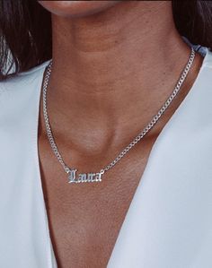 A cross between dainty and bold, the classic block lettering paired with our stylish Cuban Chain is our new favorite look. Model is wearing a 16" Chain. Metals: Sterling Silver 14K Gold over Sterling Silver Customize With: Names, Dates, Words Name Measurement: 0.4" X 1"" depends on the amount of letters. Chain Type: Cuban Chain with lobster clasp Please note the first letter is in caps. Customize your order up to 10 characters Please allow 2-3 weeks for delivery. Carrie Necklace, Silver Cuban Chain, Heartbeat Necklace, Name Necklace Silver, Nameplate Necklace, Block Lettering, Cuban Chain, Nicki Minaj, Name Necklace