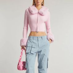 The Updated Version Of The Waterloo Peggy Cardigan From House Of Sunny Is Made With A Pink Ribbed Knit, And Is Adorned With A Detachable Faux-Fur Collar And Cuffs For A Touch Of Luxe. It Features A Slim Fit, Long Sleeves, A Round Neck, A Double Sided Zip Closure, A Cropped Cut, And A Metal Brand Plaque On The Bottom Left. Condition: Very Good; Light Snagging. Size: 4 Approximate Measurements: Shoulder: 16" (40.5 Cm) Chest: 15.5" (39 Cm) Length From Back: 16" (40.5 Cm) Sleeve Length (Without Fur, Coquette Winter, Faux Fur Cardigan, House Of Sunny, Pink Ribbed, Pink Faux Fur, Faux Fur Collar, Fur Collar, Collar And Cuff, Vol 2