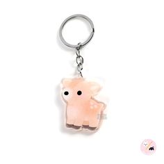 a pink keychain with an animal on it