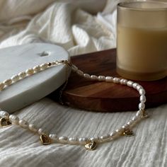 With its vintage-inspired charm and enduring quality, this Vintage-inspired  Pearl Choker Necklace is the embodiment of timeless beauty, perfect for those who appreciate the finer things in life. Embrace the allure of old money aesthetics and adorn yourself with this beautiful piece today. ⚡Freshwater Rice Pearls: Each exquisite pearl is handpicked, creating a unique piece that stands out. ⚡Old money aesthetic: Embrace the timeless and sophisticated style of old money with this necklace. ⚡Charming heart charm: The heart pendant adds a touch of romance to your look. ⚡Hypoallergenic: Safe for sensitive skin, our necklace won't cause irritation. ⚡Durable: Made to last, this necklace is perfect for everyday wear. ⚡Cute and Elegant: It's a charming accessory that complements any outfit. MATERIA Vintage Pearl Necklace For Gift, Vintage White Necklace With Heart Beads, Vintage White Heart Beads Necklace, Vintage Pearl Charm Necklaces For Gifts, Vintage Pearl Charm Necklace As A Gift, Vintage Pearl Necklace With Pearl Charm For Anniversary, Delicate Heart Necklace With Pearl Charm, Dainty Heart Necklace With Pearl Charm For Wedding, Vintage Necklaces With Heart Beads For Anniversary