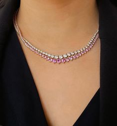 Crafted in 18-karat yellow gold, our Large Graduated Pink Sapphire 3-Prong Tennis Necklace is set with 11.03 carats of round, brilliant cut Pink Sapphires - with the largest stone set in the center and gradually get smaller - a stunning piece with timeless appeal! A styling tip from Jen - "Wear yours from day to night and everywhere in between! Layered or on its own, it's one of my all time favorites from the collection!" Carat Weight: 11.03cts Necklace measures 16" in length Push clasp fastenin Classic Diamond Tennis Necklace With Gemstones, Formal Round Diamond Necklace With Gemstones, Formal White Gold Tennis Necklace With Gemstone, Formal Cubic Zirconia Tennis Necklace With Gemstones, Fine Jewelry Tennis Necklace With Brilliant Cut, Elegant Round Gemstone Tennis Necklace, Luxury Round Gemstone Tennis Necklace, Elegant Gemstone Tennis Necklace, Formal Gemstone Tennis Necklace