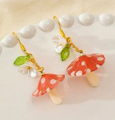 Cute mushroom fantasy forest vibe earrings to go with your everyday look 🧡 Cute Mushroom Design Dangle Earrings, Whimsical Dangle Earrings With Mushroom Design, Cute Dangle Earrings With Mushroom Design, Cute Handmade Mushroom Earrings, Cute Handmade Mushroom-shaped Earrings, Handmade Cute Mushroom Earrings, Whimsical White Mushroom Design Earrings, White Dangle Earrings With Mushroom Design, Cute White Earrings With Mushroom Design