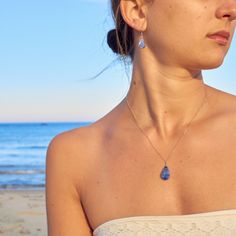 SODALITE CRYSTAL JEWELRY SET This delicate, teardrop Sodalite jewelry set is the epitome of understated beauty, making it the perfect gift for women any day of the year. The dainty blue stone necklace and earrings set is comprised of genuine indigo blue Sodalite stones. Choose either Sterling Silver 925 or 14K Gold fill as your finish. Also choose your necklace chain length: 16 inches, 18 inches or 20 inches. Please note that every Sodalite stone will vary in blue color and some will have white  striations, making each teardrop pendant beautifully unique.  The small and lightweight Sodalite stones are set in a lovely teardrop shape and are expertly wire wrapped by hand. The lightweight stone suspends 2 cm, about the height of a dime. The stone measures 1 cm at its widest point.  The chain Blue Briolette Jewelry For Party, Hypoallergenic Teardrop Jewelry Gift, Wire Wrapped Drop Jewelry For Party, Crystal Teardrop Pendant Jewelry Sets As Gifts, Sapphire Teardrop Pendant Jewelry, Wire Wrapped Teardrop Jewelry For Parties, Sapphire Crystal Drop Jewelry, Crystal Drop Jewelry Sets For Gift, Teardrop Wire Wrapped Drop Necklace Gift