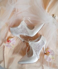 "These romantic bridal shoes feature sheer lace detailing and a vintage style lace-up for a truly unique look.  Handcrafted with floral tulle on the sides, to add a subtle touch of whimsy on your wedding dress.   These elegant heels are perfect for your wedding, but can also be styled on other occasions. Ivory floral tulle lace up wedding shoes for bride, custom heel heights available. Forever keepsake custom wedding gift, personalized wedding shoes. Custom details can be added on this design, the soles can be personalized with your names and wedding date. They are made of soft vegan leather and transparent lace, each handmade item is unique and can differ in details only slightly. Listing shoe style: 3 1/2\" (9cm) heels, closed toes, in ivory.  You can see similar tulle wedding shoes here Elegant Wedding Heels With Lace Trim, Evening Lace Wedding Shoes With Lace Trim, High Heel Wedding Shoes With Lace Trim For Evening, Elegant Wedding Shoes With Laces, Elegant Wedding Shoes With Lace Trim, Lace Heels With Lace Trim For Wedding, White Lace Trim Heels For Wedding, White High Heels With Lace Trim, Elegant Pointed Toe Wedding Shoes With Laces