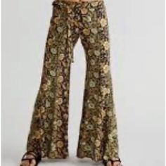 Free People Bali Sultry Flare Pants Tie Elastic Waist Floral Mix Black Gold Tan Green New Without Tags * Size: M Retail Price $128 Viscose 29'' Waist Relaxed 10 " Rise 28" Inseam Please Note Line Through Tag To Prevent Store Return Free People Pants, Flare Pants, Black Green, Black Floral, Green Colors, Pant Jumpsuit, Bali, Elastic Waist, Free People