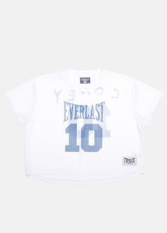 Step into the urban nostalgia of the late '70s with our women's Coney Island Picnic x Everlast Cropped Athletic Mesh Jersey Top. This white cropped short sleeve top is inspired by football jerseys, boasting an oversized, baggy fit with a crew neckline and dropped shoulders for a relaxed silhouette. Adorned with custom blue Coney x Everlast graphics at the front and back, it's a blend of retro flair and modern street style. - *NOT ELIGIBLE FOR DISCOUNT OR PROMOTION - Model is 5'10 wearing a size Modern Street Style, Mesh Jersey, Coney Island, Camping Shirt, Jersey Top, The Urban, Football Jerseys, Baggy Fits, Short Sleeve Top