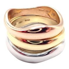 About This Piece: This is an Cartier 18K Tri-Color Gold Three-Stacking Puzzle Band Ring in size 53. The ring features three stacking bands in rose, yellow, and white gold that fit together like a puzzle. The Trinity design represents the three stages of a relationship: friendship, love, and fidelity. Cartier is known for their exceptional quality and timeless designs, and this ring is no exception. It is a beautiful and unique piece of jewelry that will make a statement on any occasion and is su Puzzle Band, Stages Of A Relationship, Relationship Stages, The Trinity, Stacking Bands, Cartier Jewelry, Friendship Love, Rose Yellow, A Relationship