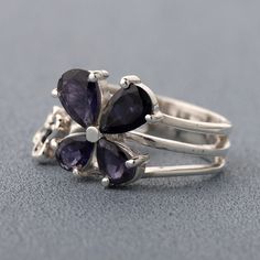 This is Solid Handmade Sterling Silver Ring with Natural Iolite Gemstone. Metal : Solid Sterling Silver with 925 Stamp. SKU - TJR1031 Stone : Natural Peridot Gemstone Stone Shape: Pear & Round Ring Size : 6 US Ring Weight - 5.2 Gms Stone Size - 5mmX7mm Pear 4mmX6mm Pear 3mmX3mm Round Please feel free to ask any query. Handcrafted Silver Jewelry, Handmade Sterling Silver Rings, Natural Gemstone Ring, Floral Ring, Natural Gemstone Jewelry, Peridot Gemstone, Handcrafted Earrings, Sterling Silver Studs, Handmade Sterling Silver