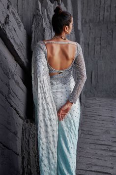 Ice blue ombre saree with silver sequin embroidered floral motifs. Paired with blouse.
Components:2
Pattern:Embroidery
Type of Work:Sequin, floral
Neckline:Deep V neck
Sleeve Length:Full sleeves
Fabric:Butterfly net, satin georgette
Color:Blue
Other Details:
Scallop bordered saree
Embroidered blouse
Back tassel detailing
Back cut-out
Closure: Blouse: Hook and eye
Occasion:Destination Wedding - Aza Fashions Silver Embellished Pre-draped Saree, Fitted Silver Pre-draped Saree With Zari Work, Silver Fitted Pre-draped Saree With Zari Work, Fitted Silver Pre-draped Saree For Designer Wear, Silver Sequined Pre-draped Saree, Silver Semi-stitched Pre-draped Saree For Designer Wear, Silver Pre-draped Saree With Mirror Work, Fitted Silver Saree With Sequins, Silver Sequined Saree For Festive Occasions