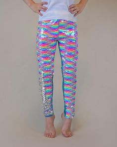 These fun, sequined pants are the perfect way to party in style! The cotton side provides breathable comfort, while the colorful reverse side is sequined flippin' fun!Front: 100% polyester Back: 100% cottonHand wash; hang dry Dress Up Leggings, Jojo Siwa Shirts, Mermaid Pants, Magic Pants, Rainbow Pants, Rainbow Leggings, Belle Costume, Sequin Leggings, Twirly Dress