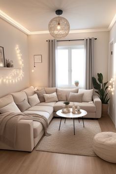 a living room filled with lots of furniture and lights on the wall above it's windows