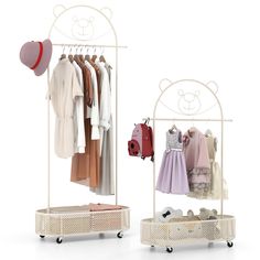 a white rack with clothes and shoes on it next to a teddy bear shaped hat