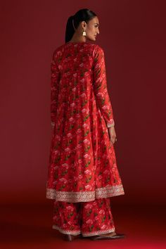 Red anarkali with all-over rain lily prints. Comes with culotte and dupatta with embroidered border and kinari.
Components: 3
Pattern: Digital Printed, Embroidered
Type Of Work: Rain Lily
Neckline: Round
Sleeve Type: Full
Fabric: Anarkali and Culotte- Raw Silk, Dupatta- Organza
Color: Red
Other Details: 
Disclaimer: The actual print-placement and colour of the product may vary slightly from the image shown.
Occasion: Wedding - Aza Fashions Red Long Sleeve Anarkali Set With Cutdana, Red Anarkali Set With Straight Kurta, Red Floral Print Straight Kurta Set, Red Traditional Wear With Printed Motifs For Transitional Season, Red Floral Print Unstitched Kurta, Red Traditional Kurta With Floral Print, Red Anarkali Sharara With Printed Motifs, Red Floral Print Straight Kurta, Red Kurta With Printed Motifs In Traditional Drape