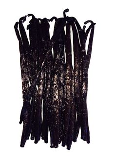 several black sticks are lined up against a white background, with the stems covered in sequins