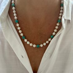 This stunning handmade necklace is a luxurious blend of elegance and natural beauty, featuring 8mm AAA grade natural white round freshwater pearls paired with 8mm round Kingman turquoise beads, sourced from the renowned Kingman Turquoise Mine in Kingman, Arizona, USA. The piece is thoughtfully finished with your choice of gold-filled or sterling silver rondelle spacer beads and a toggle clasp, adding a refined touch to this already exquisite design. The necklace exudes a rich, opulent feel with Elegant Turquoise Necklace With 8mm Beads, Elegant Turquoise Jewelry With Natural Stones, Elegant Turquoise Jewelry With 8mm Beads, Elegant Single Strand Turquoise Necklace, Elegant Turquoise Single Strand Necklace, Elegant Turquoise Gemstone Necklace, Elegant Turquoise Pearl Necklace, Elegant Turquoise Necklace With Gemstone Beads, Elegant Single Strand Turquoise Jewelry