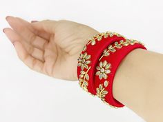 * Handmade Item: Beautifully handcrafted, these silk thread bangles have an excellent finish and promulgate an exquisite sense of style with kundan. * This is perfect gift for festive season or you can split it up and be creative to wear as casual jewelry or date night accessories * Avoid water What's Included: 1 handmade bangle pair Material: Silk Thread, Kundan Stones, Plastic Allergy: Nickel free Jaipur Loft  jewelry is handmade by skilled artisans in Rajasthan, India using traditional, centuries old jewelry making techniques.  * All jewelry pieces are sanitized and cleaned with jewelry cleaner before packing. * All our jewelry pieces are delivered ready as gifts, packaged in a cotton filled paper box and a bow tie ribbon. Care Instruction :  * Avoid Heat & Chemicals Like perfume, Deo, Festive Handwork Bangle, Handwork Bangle Bracelets For Party, Handwork Bangle Bracelet For Party, Handmade Bangle Bracelet For Parties, Handwork Bangle Jewelry For Party, Gold Embroidered Bracelets For Wedding, Silk Thread Bangle Bracelets For Weddings, Gold Silk Thread Bangle Jewelry, Gold Silk Thread Bangle