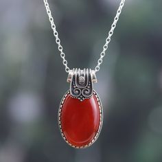 The royal ornaments of the classic Indian palaces rest now in this sublime creation by local artisans. Presented by Alok Jain, this sterling silver pendant necklace features a combination of polished and oxidized finishes that enhance each of the traditional motifs embellishing the piece, also crowned with a natural carnelian jewel to represent your fearless soul. Indian Palaces, Fearless Soul, Carnelian Pendant, Traditional Motifs, Garnet Pendant, Silver Work, Floral Jewellery, Sterling Silver Necklace Pendants, Local Artisans