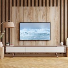 a flat screen tv sitting on top of a wooden wall