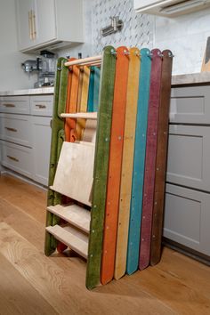 multicolored wooden rack in the middle of a kitchen