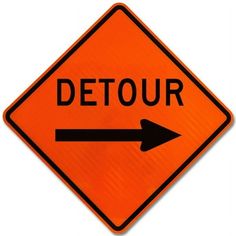 an orange detour sign with an arrow pointing to the right on white background photo