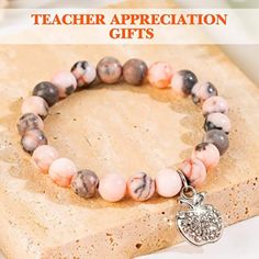 🍎✨ Show your appreciation with our Natural Stone Teacher Bracelet with Thank You Gift Card! 📚🎁 Let this thoughtful gift be a token of gratitude for the amazing teachers in your life. 💖 Crafted with genuine natural stones, each bracelet carries positive energy and heartfelt vibes. 💫 Whether it's for an end-of-year gift or just because, this bracelet and gift card combo is the perfect way to say "thank you" with style! 🌟✨ Express your admiration and make their day extra special with our teac Mother's Day Gift Bracelets With Natural Stones, Natural Stone Bracelets For Mother's Day Gifts, Natural Stones Bracelets For Mother's Day, Inspirational Round Beads Jewelry Gift, Spiritual Beaded Bracelets For Mother's Day Gift, Inspirational Bracelets With Round Beads For Gifts, Inspirational Round Beaded Bracelets For Gifts, Inspirational Round Beads Bracelet As A Gift, Inspirational Round Bracelets As Gift