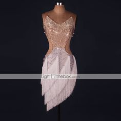 the back of a dress on a mannequin with sequins and beads