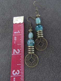 Asian Coin Earrings, Jadeite and Bronze - Etsy Bohemian Round Jade Earrings, Vintage Jade Round Earrings, Coin Earrings, Favorite Jewelry, Jewelry Earrings Dangle, Beauty Book, Dangle Drop Earrings, Coin, Dangle Earrings