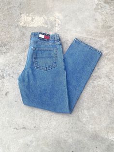 Vintage 1990s Tommy Hilfiger Blue Jeans - Size 34W x 32L - Outseam 42" Inseam 31.5" - Great vintage condition (small stain pictured) - Message for more information Please take note of the measurements listed as these are vintage clothes and may fit different than the tag size. Follow our page for more vintage clothing drops! DISCLAIMER: All items are vintage so please be mindful that if by chance there is a flaw on the item we simply may have just missed it. Inquire for more product information. 90s Inspired Medium Wash Straight Leg Jeans, 90s Inspired Straight Leg Medium Wash Jeans, 90s Inspired Medium Wash Denim Jeans, 90s Inspired Denim Blue Jeans With Pockets, 90s Inspired Medium Wash Cotton Jeans, 90s Blue Jeans With Five Pockets, 90s Style Straight Leg Denim Jeans, 90s Style Blue Jeans, 90s Inspired Medium Wash Jeans With Pockets