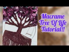 the macrame tree of life is made with purple yarn and tassels