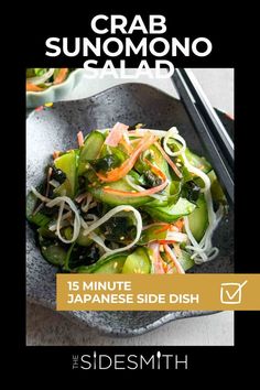 a bowl filled with salad next to chopsticks