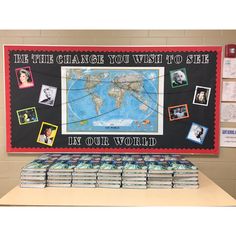 a bulletin board with pictures on it that says, be the change you wish to see in our world