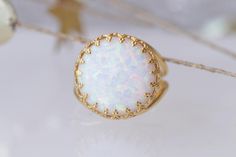 WHITE OPAL RING, Big Stone Ring, October Birthstone Jewelry, Ring With Gemstone, Gold Filled Ring, Anniversary Ring, Opal Statement Ring . Details of item: Metal: 14k gold filled Gemstone: white opal OR light blue stone Front Size: 16 mm Available all size us The ring will be packed in a gift box. , FOR MATCHING EARRINGS HERE: https://www.etsy.com/il-en/listing/271149965/white-opal-gold-earrings-for-bride?ga_search_query=FIRE+OPAL+EARRINGS&ref=shop_items_search_21 FOR ALL OPAL RING HERE: htt Ring With Gemstone, Opal Statement Ring, Fire Opal Earrings, October Birthstone Jewelry, Big Stone Ring, Ear Crawler Earrings, White Opal Ring, Lace Ring, Ring Opal