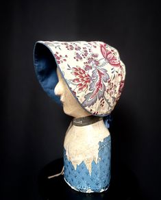 Item Details. From Europe, probably France, a delightful chintz bonnet, possibly theatrical. Dating from the 1920s it's is made in a 19th century style and is lined throughout in a soft indigo blue cotton. The chintz is a print inspired by an 18th century Indian chintz. The original silk ribbon is perished and would benefit from being relaxed. Perfect for film and television or display. Measurements: 19cm high x 19cm across (7.5inches high x 7.5inches across.) Head circumference  59cm (23inches) Condition. In excellent antique condition, there is an overall patina of age commensurate with its age, as mentioned the antique silk ribbon needs replacing. Further Notes. We have lots more original and quality vintage items and textiles in our shop, https://www.etsy.com/uk/shop/TheTextileTreasury Handmade Adjustable Vintage Bonnet, Adjustable Cotton Vintage Bonnet, Indian Chintz, Floral Costume, 19th Century Style, Vintage Home, Silk Ribbon, Head Circumference, Recycled Packaging