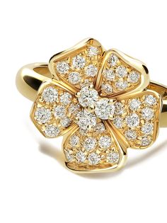 a yellow gold ring with diamonds on it's center and two petals in the middle