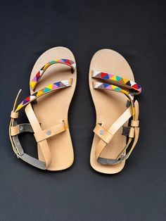 Unique Africa Maasai Handcrafted Beaded Leather Sandals with an Elegant Look and Brilliant Finish. Color =Multi Color. Size = Optional. **GET FREE SHIPPING FOR ADDITIONAL ITEMS PURCHASED. Yes, Buy Multiple Items and pay shipping for 1 item only- The rest ships Free. (No Limits on the number of Multiple items). With a faster delivery time of 3 days via DHLExpress, Worldwide. Ordinary/Standard Shipping also available upon request. We Custom Make to Suit Your Taste. Available In All Colors and Size Handmade Flat Adjustable Sandals, Handmade Adjustable Flat Sandals, Multicolor Open Toe Sandals With Adjustable Strap, Multicolor Toe Loop Sandals For Vacation, Multicolor Toe Loop Sandals For Beach, Multicolor Adjustable Sandals, Multicolor Adjustable Strap Sandals, Traditional Sandals With Adjustable Ankle Strap, Handmade Multicolor Open Toe Barefoot Sandals