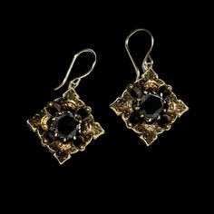 These ornate vintage onyx earrings have exceptional texture and visual appeal. Neutral-toned and stylish: a perfect combo that adds flair to any outfit. Vintage, handmade in gold-fill with onyx gemstones Earrings measure ~25mm in length and width Features two prong set ~8mm rose-cut onyx Secured with new gold-fill earwires Because we do all our restoration work by hand, we can offer a huge array of customization. If you have inquiries about sizing, alterations, or engraving, you can inquire abou Gemstones Earrings, Velvet Ring Box, Outfit Vintage, Onyx Earrings, Paper Jewelry, Buying Jewelry, Antique Items, Ring Box, Rose Cut