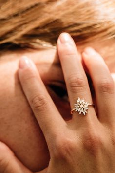 a close up of a person wearing a ring