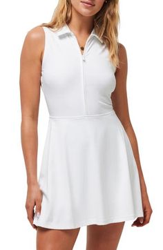 This sporty dress is cut from stretch fabric with built-in shorts and a close-fitting style that lets you move in total comfort. 33" length; 4 1/2" inseam; 18" leg opening (size Medium) Half-zip closure Spread collar Sleeveless Hidden ball pocket. Built-in shorts 80% nylon, 20% elastane Machine wash, tumble dry Imported Spring Stretch Elastane Tennis Dress, Athleisure Fitted Mini Tennis Dress, Fitted Mini Length Tennis Dress In Athleisure Style, Casual Stretch Tennis Dress, Short Length, Casual Stretch Tennis Dress In Short Length, Fitted White Tennis Dress For Sports, Fitted Mini-length Elastane Tennis Dress, Stretch Elastane Mini Tennis Dress, Spring Stretch Tennis Dress, Short Length