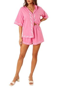 A squiggly pattern exudes laid-back vibes in this charming two-piece set that's ready to be added to your vacation packing list. Top has front button closure; spread collar; short sleeves Shorts have elastic waist Partially lined 100% cotton Hand wash, dry flat Imported Pink Summer Loungewear Short Set, Pink Short Set For Summer Loungewear, Pink Cotton Short Set For Beach, Pink Matching Short Set For Summer, Pink Matching Set Tops For Vacation, Pink Spring Short Set For The Beach, Pink Cotton Sets For Day Out, Pink Spring Short Set For Beach, Pink Short Set For Spring Beach Outings