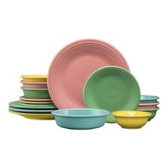 a stack of colorful plates and bowls on a white background