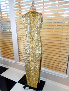 "This is an AMAZING oriental vintage gown fully embellished with bright gold sequins and accented with red, pink, green, silver and blue sequins and beading in an amazing abstract bird design. It's in absolutely PERFECT condition! Measurements: Bust - 34\" Waist - 28\" Hips - 36\" Dress Length - 55\" Side Slits - 28\" long This dress comes from a pet-free and smoke-free home. If you would like more info or have any questions, please ask!" Gold Sleeveless Sequined Gown, Gold Sequin Dress With Contrast Detail For Wedding, Gold Sequined Sleeveless Gown, Gold Sleeveless Gown With Sequins, Sleeveless Gold Gown With Sequins, Gold Sleeveless Evening Dress With Sequins, Gold Sleeveless Sequined Evening Dress, Glamorous Dresses For Festivals And Celebrations, Glamorous Gold Floor-length Sequin Dress