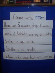 a sign with writing on it that says oceans song there are 5 oceans, deep & wide pacific and atlantic are by our sides