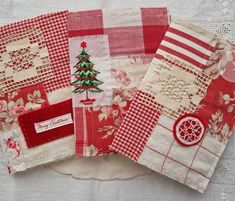 three pieces of red and white quilted fabric with christmas tree on top, one piece has lace