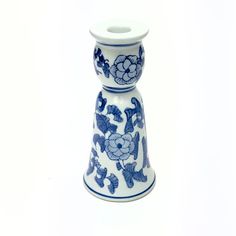 a blue and white vase with flowers on it