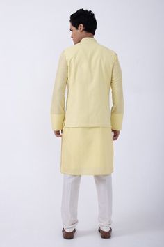 Yellow bam silk kurta with thread embroidered cuffs. Comes with ivory cotton silk pyjama and a suiting bundi jacket with cutdana work. - Aza Fashions Fitted Nehru Jacket In Cotton Silk With Straight Cut, Fitted Cotton Silk Nehru Jacket, Fitted Nehru Jacket In Cotton Silk, Cotton Nehru Jacket With Gota Work For Wedding, Cotton Nehru Jacket With Gota Work For Diwali, Kurta Set Men, Cutdana Embroidery, Cutdana Work, Embroidered Cuffs